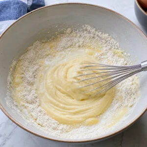Dutch pancake batter whisked from the center into a smooth thick paste