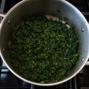 Chopped spinach cooking in butter