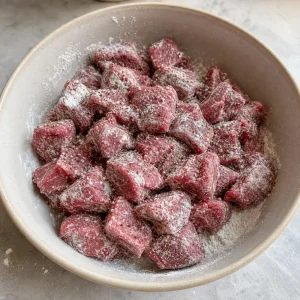 Beef cubes dusted with flour and seasoning