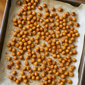 Golden roasted chickpeas on parchment paper