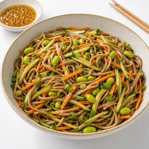 Soba noodle salad coated with sesame ginger dressing