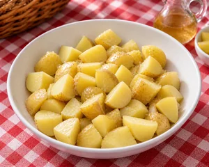 Warm drained potatoes tossed with apple cider vinegar
