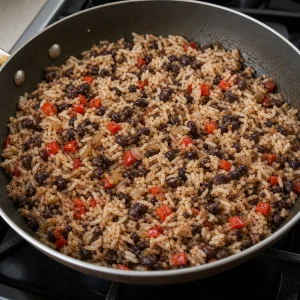 White rice folded into black beans and peppers