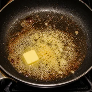 Garlic cooking in foaming butter