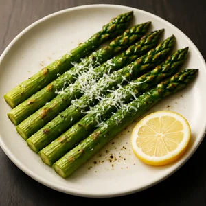 Hot asparagus topped with grated Parmesan on a clean plate.