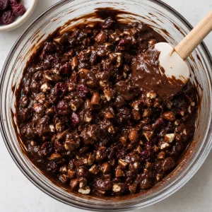 Chopped nuts and dried cherries folded into melted dark chocolate