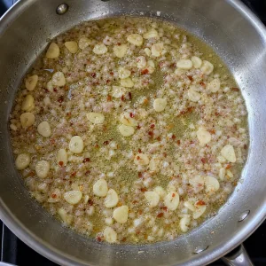 Garlic and shallot sizzling gently in butter with red pepper flakes