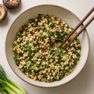 Mushroom, bok choy, tofu, ginger, soy sauce, and sesame oil mixed for dumpling filling.