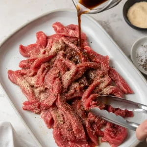 Thin steak strips seasoned with Worcestershire and spices