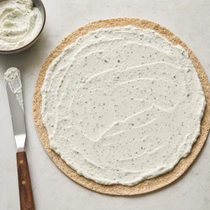 Whole wheat tortilla spread with creamy yogurt ranch