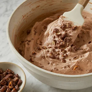 Chocolate-coated pretzels folded into ice cream base
