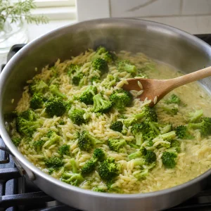 Broccoli folded into nearly tender orzo