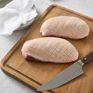 Duck breasts patted dry with the skin scored in a neat crosshatch pattern