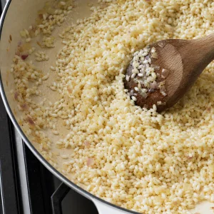 Arborio rice toasted in butter until the edges turn translucent