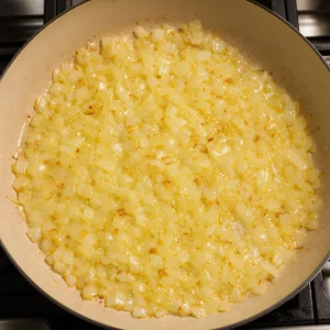 Chopped onions cooking in butter until soft and lightly golden
