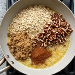 Oats, pecans, brown sugar, and cinnamon in melted butter