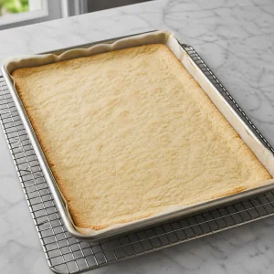 Parbaked slab pie crust cooling on a rack