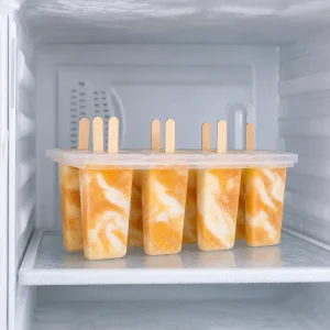 Peach yogurt swirl pops freezing level in their mold
