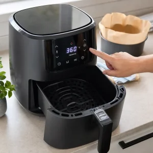 Air fryer preheating to 360 degrees for Basque cheesecake
