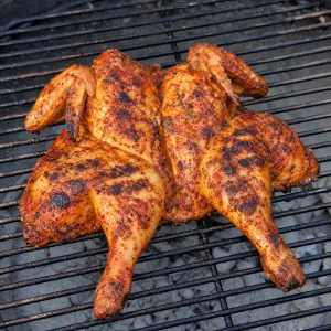 Piri piri chicken skin side down on the grill