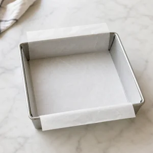 Square pan lined with parchment paper