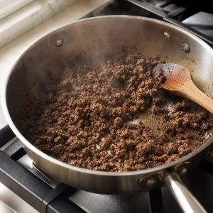 Ground beef browned in a wide skillet
