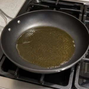 Olive oil warming in a nonstick skillet