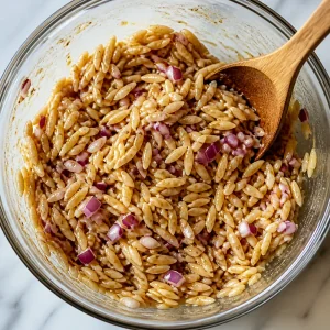 Orzo and red onion tossed with balsamic dressing