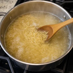 Orzo boiling in a pot of salted water